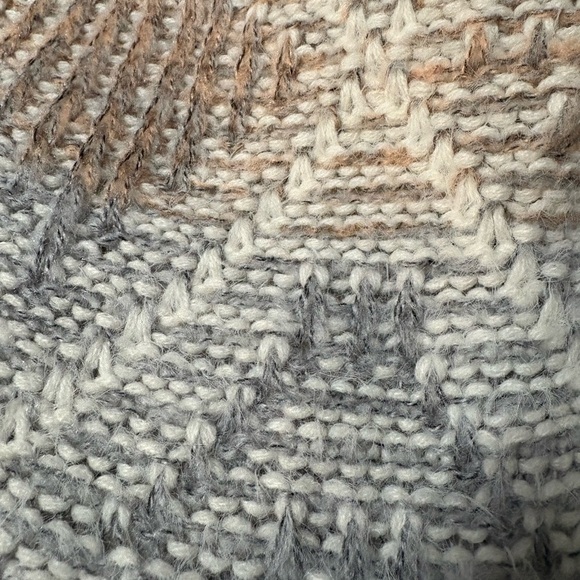 Cute V neck diamond pattern sweater with fringe on sleeves. Muted colors - Picture 8 of 12